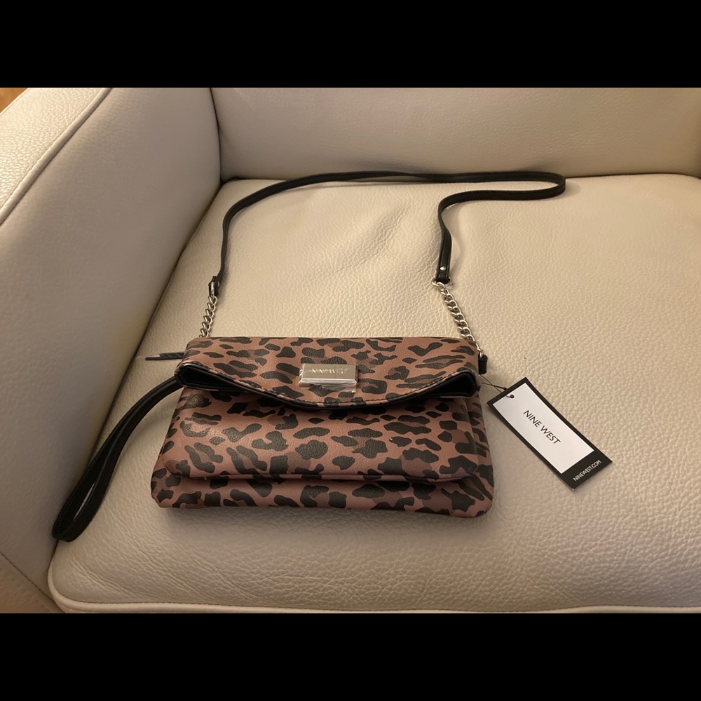 Crossbody w/ 2 compartments and detachable strap.